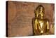 Golden Buddha Statue in Front of Burmese Writing on Wall, Bagan, Myanmar-Harry Marx-Premier Image Canvas