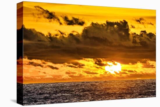 Golden light of the setting sun reflects a red glow on the beach at Pererenan Beach, Bali.-Greg Johnston-Premier Image Canvas