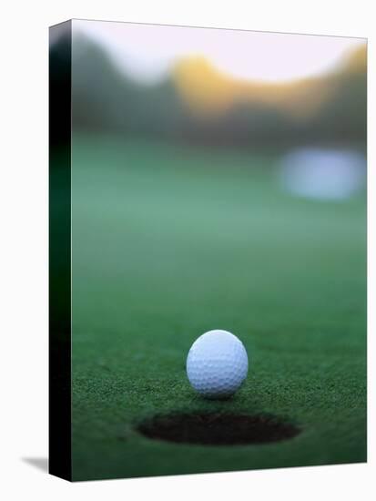 Golf Ball Close to Hole-Robert Llewellyn-Premier Image Canvas
