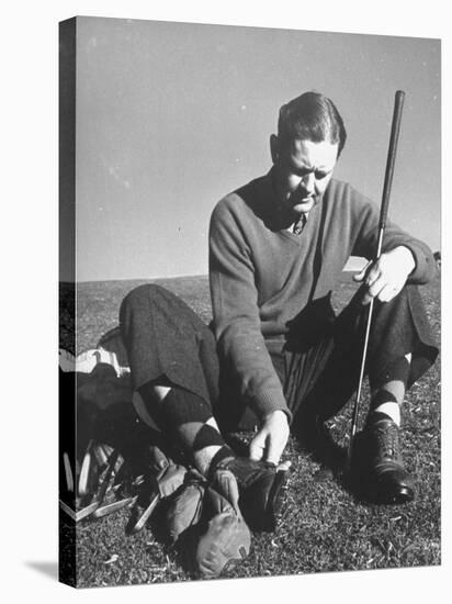 Golfer Byron Nelson Cleaning the Cleats on His Shoes-Gabriel Benzur-Premier Image Canvas