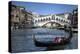 Gondola Grand Canal with Rialto Bridge in Background, Venice, Italy-Darrell Gulin-Premier Image Canvas