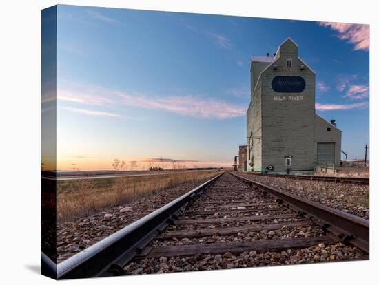 Grain elevator and railroad track, Milk River, Alberta, Canada-null-Premier Image Canvas