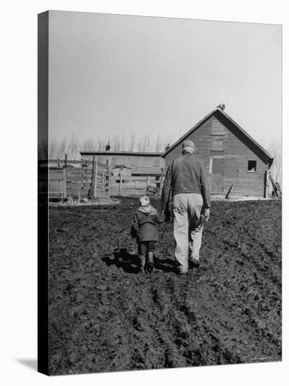Grandpa and 4 Year Old Granddaughter, on Morning Chores, to Feed Pigs on Nearby Lot-Gordon Parks-Premier Image Canvas