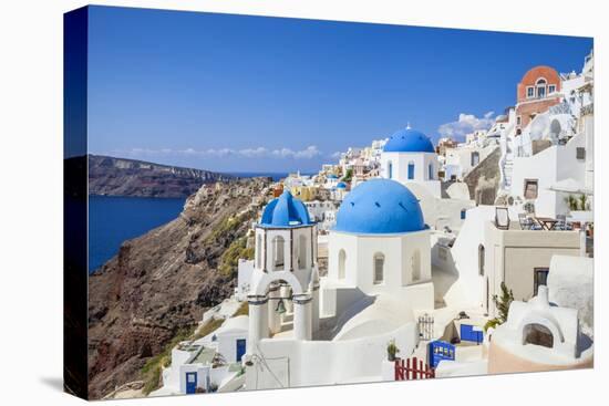 Greek Church with Three Blue Domes in the Village of Oia-Neale Clark-Premier Image Canvas