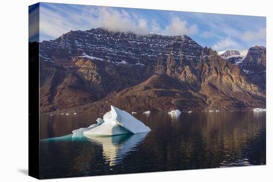 Greenland. Scoresby Sund. Milne Land. Small icebergs and rocky mountains.-Inger Hogstrom-Premier Image Canvas