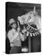 Groom Cleaning Horse's Teeth During Filming of the Movie "The Ziegfeld Follies"-John Florea-Premier Image Canvas