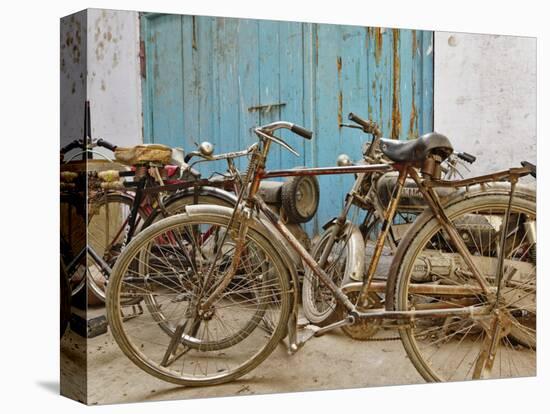 Group of bicycles in gulley (alley) Delhi, India-Adam Jones-Premier Image Canvas