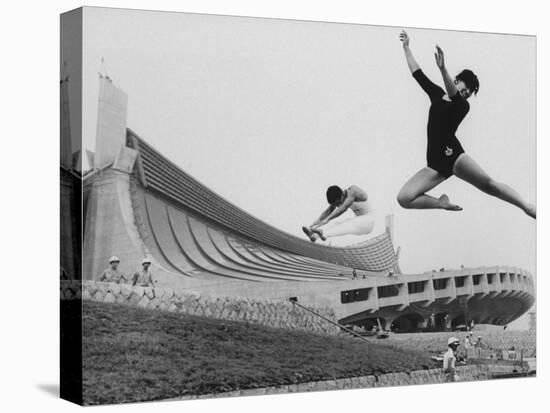 Gymnasts Outside the New Olympic Building in Japan-Larry Burrows-Premier Image Canvas