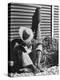 Haitian Native Engaged in a Siesta Next to Giant American Toothbrush Ad He Totes Around the Streets-Rex Hardy Jr.-Premier Image Canvas