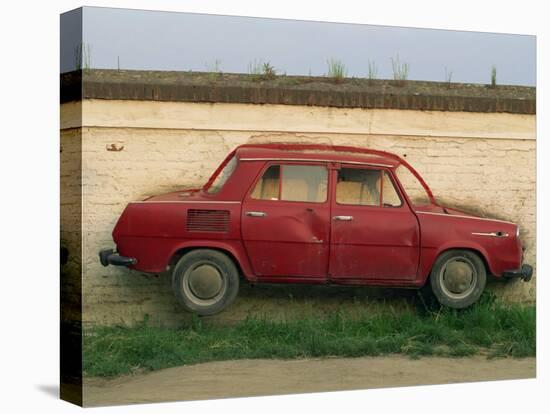 Half a Skoda on a Wall in a Car Salesyard Near Piestany, Slovakia, Europe-Strachan James-Premier Image Canvas