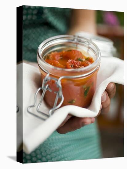 Hands Holding Preserving Jar of Tomato Sauce-null-Premier Image Canvas