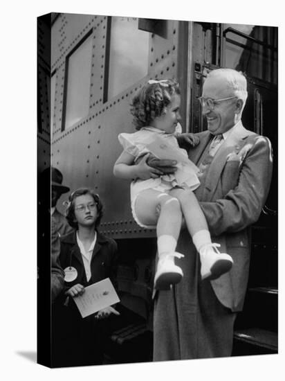 Harry Truman Holding up 3 Yr Old Suzanne Bump after the Town's Postmaster Pressed Her into Service-Hank Walker-Premier Image Canvas