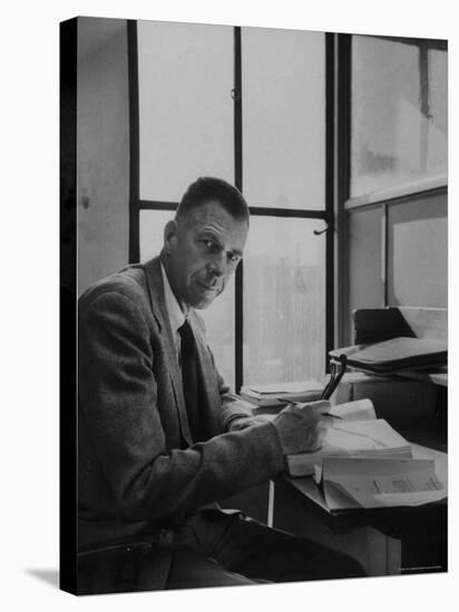 Harvard University Professor John Kenneth Galbraith Sitting in a Harvard Library-Dmitri Kessel-Premier Image Canvas