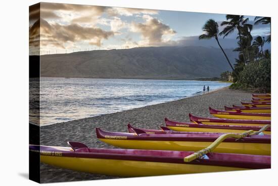 Hawaii, Maui, Kihei. Outrigger canoes on Kalae Pohaku beach and palm trees.-Janis Miglavs-Premier Image Canvas