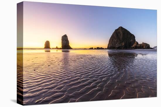 Haystack Rock and The Needles at sunset, with textured sand in the foreground-francesco vaninetti-Premier Image Canvas