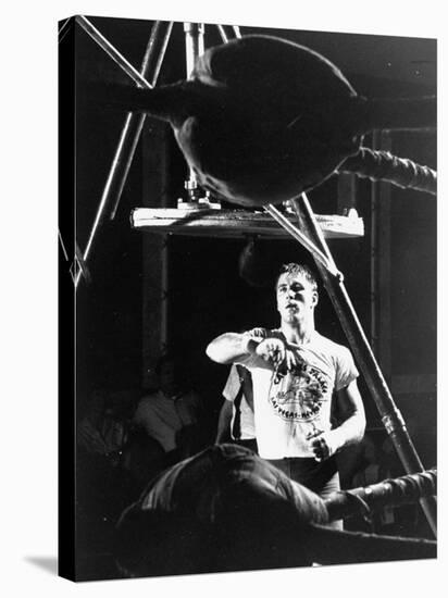 Heavyweight Boxing Contender Jerry Quarry Working Out on Punching Bag, Training at Caesar's Palace-Richard Meek-Premier Image Canvas