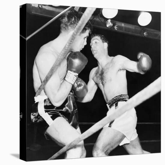 Heavyweight Champion Rocky Marciano (Right) Backs Roland Lastarza Against the Ropes-null-Stretched Canvas