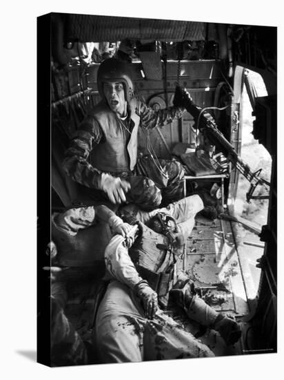 Helicopter Crew Chief James C. Farley Shouting to Crew as Wounded Comrades Lay Dying at His Feet-Larry Burrows-Premier Image Canvas