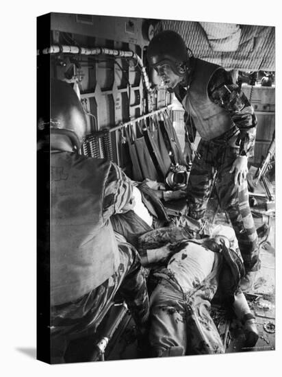 Helicopter Crew Chief James C. Farley with Wounded Pilot Lt. James Magel Lays Dying at His Feet-Larry Burrows-Premier Image Canvas