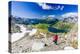 Hiker walking on mountain ridge above the blue lake Montespluga, Madesimo, Valle Spluga, Valtellina-Roberto Moiola-Premier Image Canvas