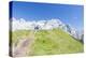 Hikers proceed on the path to the rocky peaks, Doss Del Sabion, Pinzolo, Brenta Dolomites, Trentino-Roberto Moiola-Premier Image Canvas