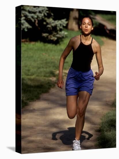 Hispanic Woman Running for Exercise-null-Premier Image Canvas