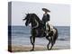 Horseman in Traditional Dress Riding Black Andalusian Stallion on Beach, Ojai, California, USA-Carol Walker-Premier Image Canvas