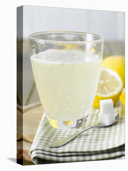 Hot Lemon with Sugar Cubes, Lemons in Background-Kai Schwabe-Premier Image Canvas