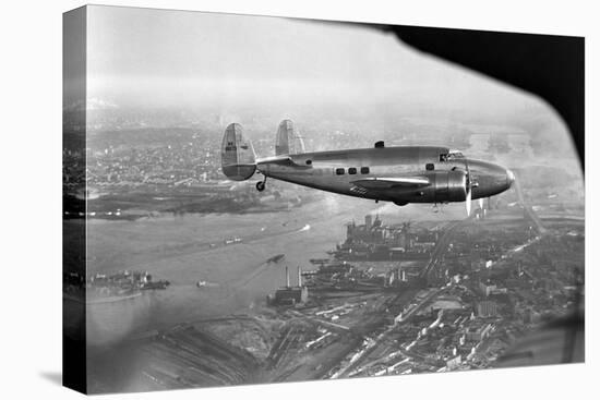 Howard Hughes Lockheed 14 Super Electra over New York City-null-Premier Image Canvas