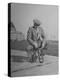 Humorous of Man Riding Tiny Bicycle-Wallace Kirkland-Premier Image Canvas