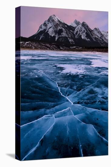 Ice cracks along Abraham Lake in Banff, Canada with purple clouds and scenic mountains-David Chang-Premier Image Canvas