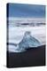 Iceberg from melting glacier on black sand beach near Jokulsarlon glacier lagoon-Ed Hasler-Premier Image Canvas