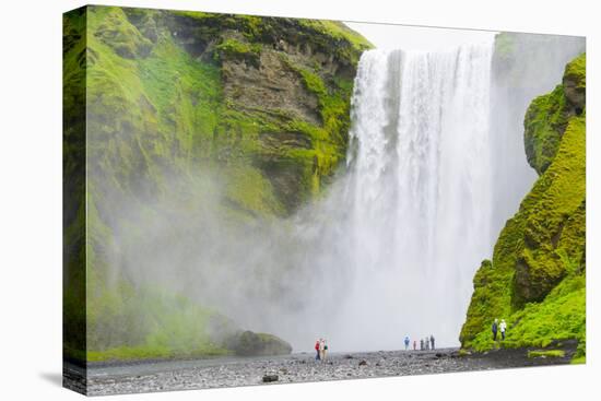 Iceland. South. Skogafoss. Hikers are Skogafoss Waterfall-Inger Hogstrom-Premier Image Canvas