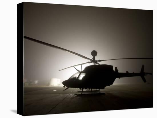 Illumination from the Bright Light Silhouettes of OH-58D Kiowa Helicopter During Thick Fog-Stocktrek Images-Premier Image Canvas