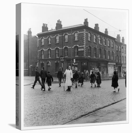 In Liverpool, a Lollipop Lady Helps Children Cross a Cobbled Street-Henry Grant-Premier Image Canvas