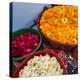 India, Rajasthan, Pipar. vendor making necklaces of marigolds and roses-Alison Jones-Premier Image Canvas