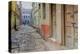 India, Varanasi a Man Walking Down a Stone Tiled Street in the Downtown Area-Ellen Clark-Premier Image Canvas