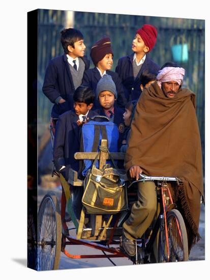 Indian Children Ride to School on the Back of a Cycle Rickshaw-null-Premier Image Canvas