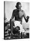 Indian Leader Mohandas Gandhi Using His Spinning Wheel in Bungalow at His Nature Clinic-Margaret Bourke-White-Premier Image Canvas