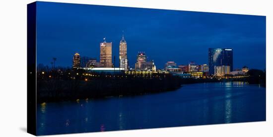 Indianapolis State Capitol and skyline at dusk along White River State Park-null-Stretched Canvas