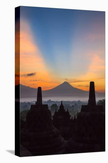 Indonesia, Java, Borobudur. Sunrise over the Active Stratovolcano-Nigel Pavitt-Premier Image Canvas