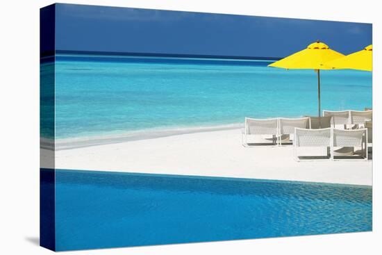 Infinity Pool and Lounge Chairs, Maldives, Indian Ocean, Asia-Sakis Papadopoulos-Premier Image Canvas