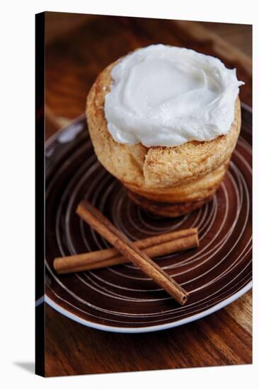 Inside Out Cinnamon Bun Shaped Like A Cupcake Garnished With Light Cream Cheese Icing-Shea Evans-Stretched Canvas