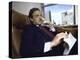 Investment Banker George Soros Working on Phone in Office-null-Premier Image Canvas
