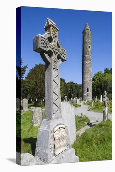 Ireland, County Wicklow, Glendalough, Celtic cross and Round Tower-Walter Bibikow-Premier Image Canvas