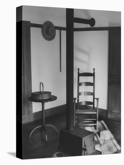 Iron Woodstove with a Ladder Backed Wooden Armchair in a Restored Shaker Parlor-John Loengard-Premier Image Canvas