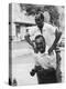 Italian Man Leaping Onto a Friend's Back in Casual Greeting While Crossing a Piazza-Paul Schutzer-Premier Image Canvas