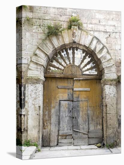 Italy, Basilicata, Matera. Old ornate wooden door in the old town of Matera.-Julie Eggers-Premier Image Canvas