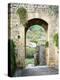 Italy, Chianti, Monteriggioni. Looking out an arched entrance into the walled town.-Julie Eggers-Premier Image Canvas