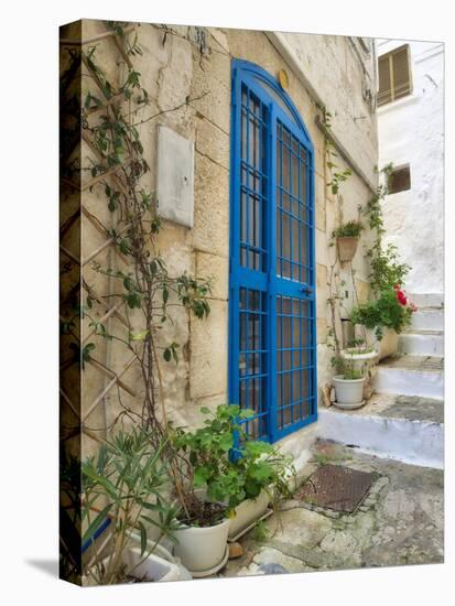 Italy, Puglia, Brindisi, Itria Valley, Ostuni. Blue door and potted plants in old town.-Julie Eggers-Premier Image Canvas
